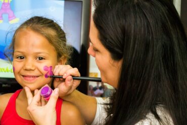 Child getting her face painted